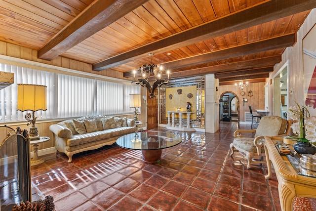 918 Grace Ave, Lake Worth, FL 33461 - living area with a chandelier, a wooden ceiling with exposed beams, arched walkways, and wooden walls