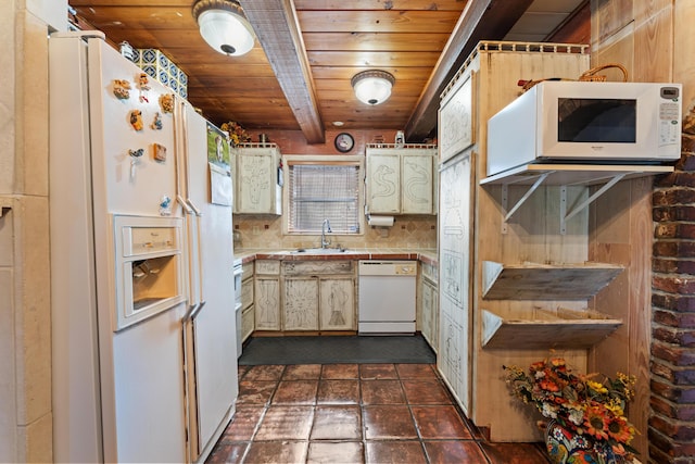918 Grace Ave, Lake Worth, FL 33461 - kitchen with white appliances, a wood ceiling with exposed beams, backsplash, light countertops, and cream cabinets