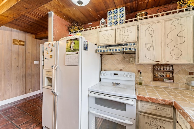 918 Grace Ave, Lake Worth, FL 33461 - kitchen with white appliances, wood ceiling, tile counters, ventilation hood, and decorative backsplash