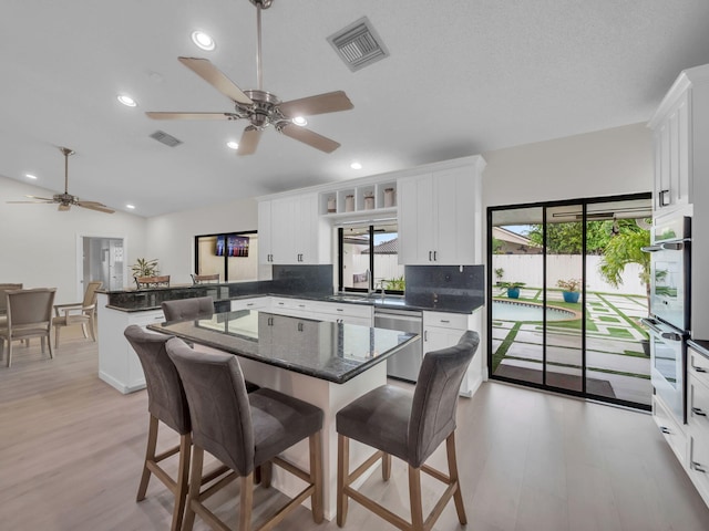 1598 SW 19th St, Boca Raton, FL 33486 - kitchen with stainless steel appliances, a peninsula, ceiling fan, plenty of natural light, and recessed lighting