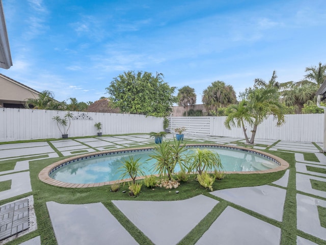1598 SW 19th St, Boca Raton, FL 33486 - view of swimming pool with a fenced backyard and a patio area