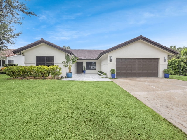 1598 SW 19th St, Boca Raton, FL 33486 - ranch-style home featuring a front yard, an attached garage, driveway, and stucco siding