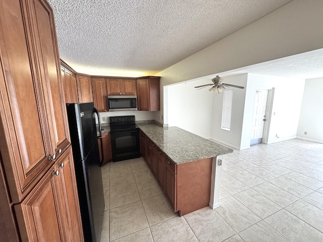 1119 Green Pine Blvd Unit C1, West Palm Beach, FL 33409 - kitchen with black appliances, a textured ceiling, light tile patterned flooring, ceiling fan, and a peninsula