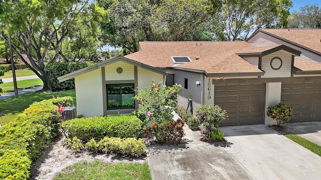 18619 Breezy Palm Way, Boca Raton, FL 33496 - view of front of property with roof with shingles, a garage, stucco siding, and concrete driveway