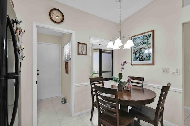 18619 Breezy Palm Way, Boca Raton, FL 33496 - dining space with a chandelier and light tile patterned floors