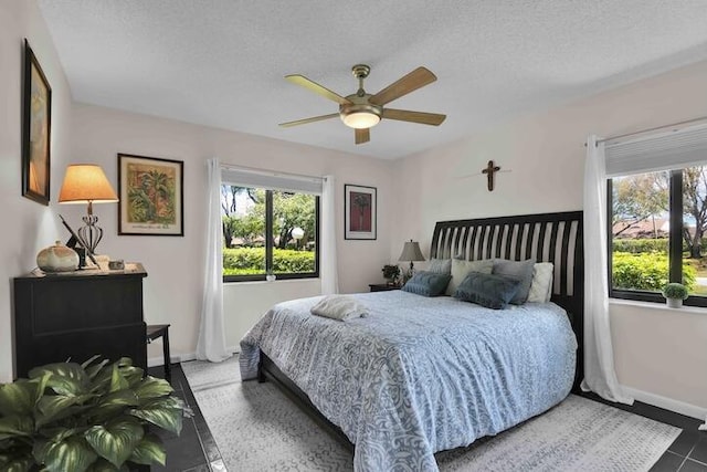 18619 Breezy Palm Way, Boca Raton, FL 33496 - bedroom featuring multiple windows, a textured ceiling, and a ceiling fan