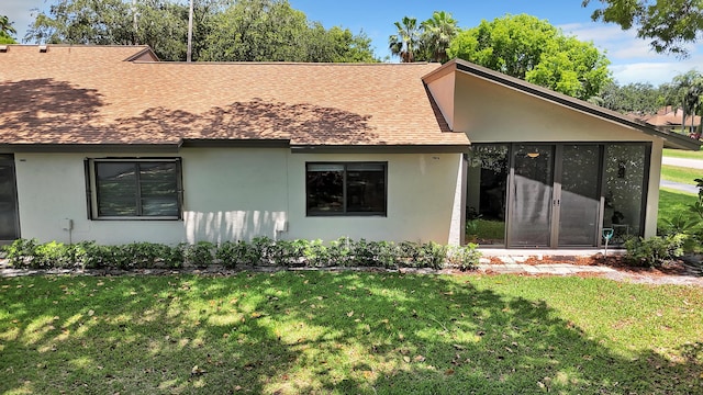 18619 Breezy Palm Way, Boca Raton, FL 33496 - view of front of house with stucco siding, a front lawn, and roof with shingles