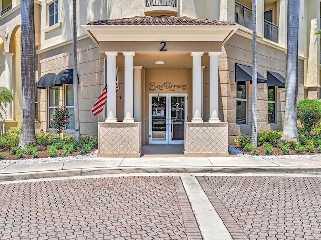 2 Renaissance Way Unit 302, Boynton Beach, FL 33426 - doorway to property featuring french doors, stucco siding, and a tile roof