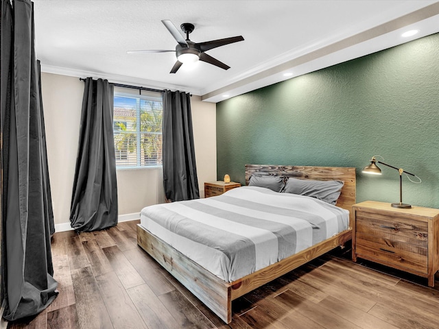 2 Renaissance Way Unit 302, Boynton Beach, FL 33426 - bedroom with ornamental molding, wood finished floors, a textured wall, a ceiling fan, and recessed lighting