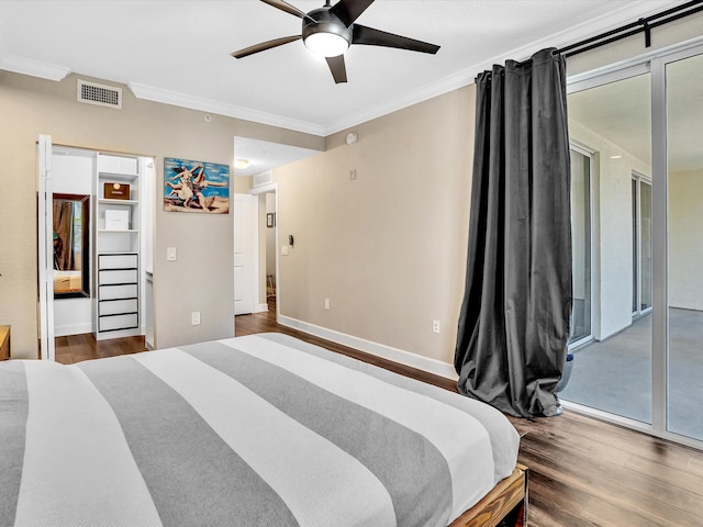 2 Renaissance Way Unit 302, Boynton Beach, FL 33426 - bedroom featuring ornamental molding, access to exterior, wood finished floors, and a ceiling fan