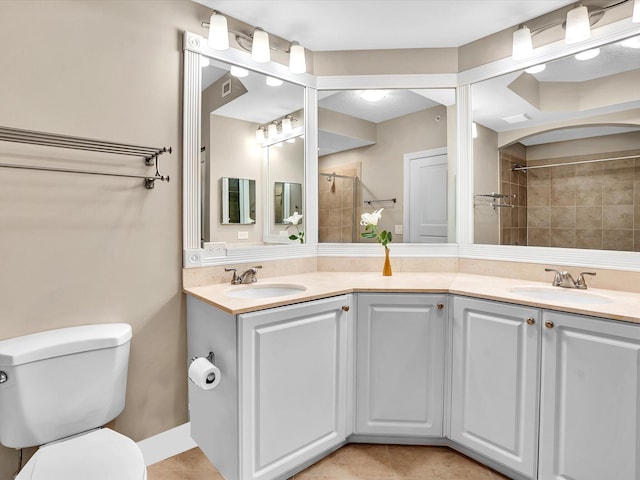 2 Renaissance Way Unit 302, Boynton Beach, FL 33426 - bathroom featuring double vanity, a tile shower, and tile patterned floors