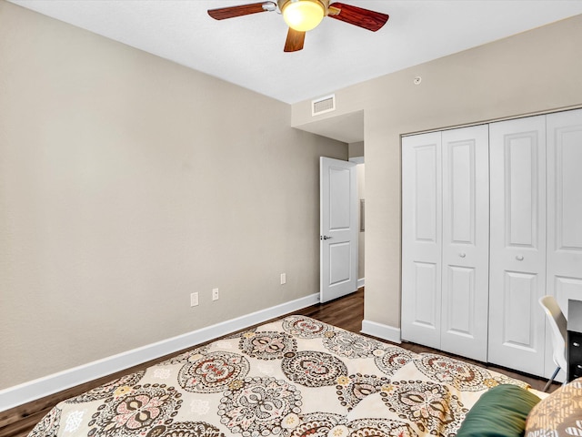 2 Renaissance Way Unit 302, Boynton Beach, FL 33426 - bedroom with dark wood-style floors, a closet, and ceiling fan
