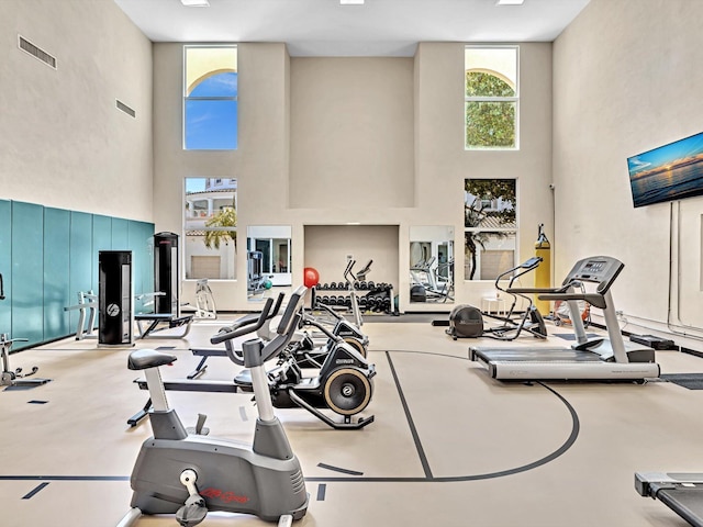 2 Renaissance Way Unit 302, Boynton Beach, FL 33426 - exercise room featuring a towering ceiling