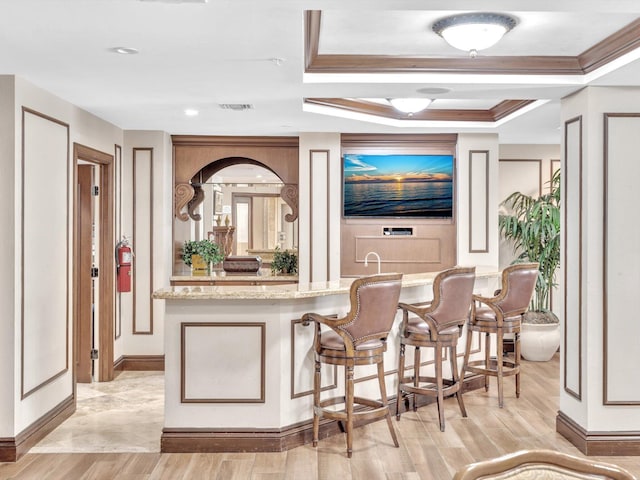 2 Renaissance Way Unit 302, Boynton Beach, FL 33426 - bar area featuring light wood finished floors and a raised ceiling