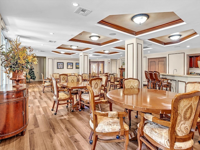 2 Renaissance Way Unit 302, Boynton Beach, FL 33426 - dining area with coffered ceiling, ornate columns, crown molding, and light wood-style flooring