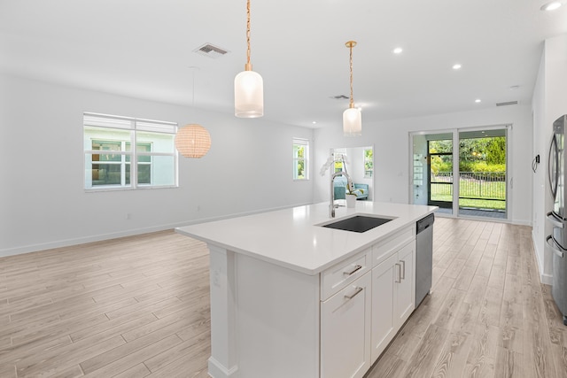 11695 SW Viridian Blvd, Port Saint Lucie, FL 34987 - kitchen featuring open floor plan, light wood finished floors, appliances with stainless steel finishes, and recessed lighting