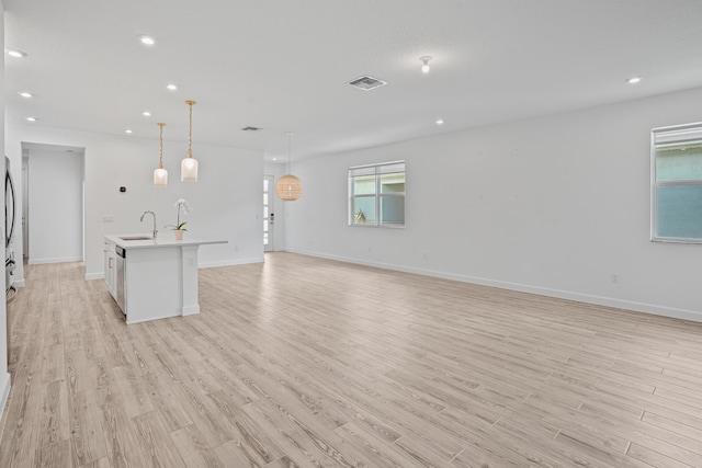 11695 SW Viridian Blvd, Port Saint Lucie, FL 34987 - unfurnished living room with light wood finished floors and recessed lighting