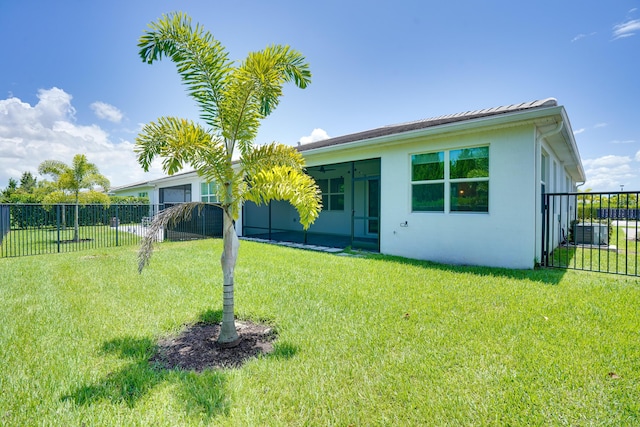 11695 SW Viridian Blvd, Port Saint Lucie, FL 34987 - back of property with stucco siding and a sunroom