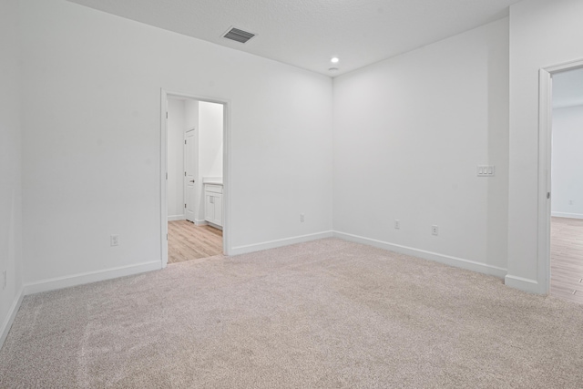 11695 SW Viridian Blvd, Port Saint Lucie, FL 34987 - spare room with light colored carpet and recessed lighting