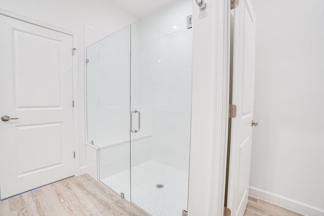 11695 SW Viridian Blvd, Port Saint Lucie, FL 34987 - full bath featuring wood finished floors and a shower stall