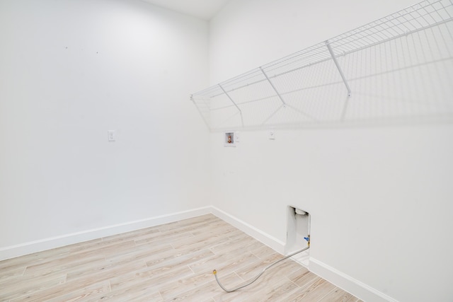 11695 SW Viridian Blvd, Port Saint Lucie, FL 34987 - laundry area featuring washer hookup, light wood finished floors, and hookup for a gas dryer