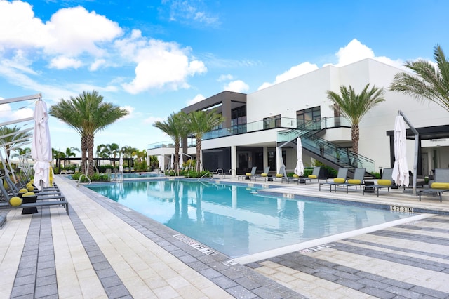 11695 SW Viridian Blvd, Port Saint Lucie, FL 34987 - community pool featuring stairway and a patio