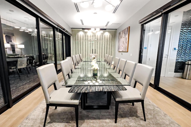 11695 SW Viridian Blvd, Port Saint Lucie, FL 34987 - dining space with a chandelier and wood finished floors