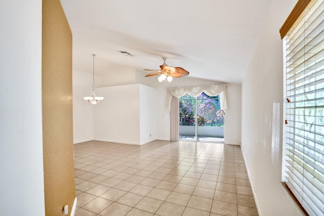 8140 Palm Gate Dr, Boynton Beach, FL 33436 - unfurnished room featuring ceiling fan, lofted ceiling, light tile patterned floors, and a chandelier