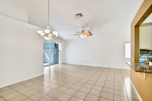 8140 Palm Gate Dr, Boynton Beach, FL 33436 - spare room featuring a chandelier, plenty of natural light, a ceiling fan, and light tile patterned floors
