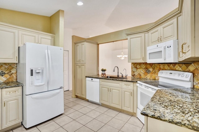 8140 Palm Gate Dr, Boynton Beach, FL 33436 - kitchen featuring white appliances, light tile patterned flooring, backsplash, dark stone counters, and a chandelier
