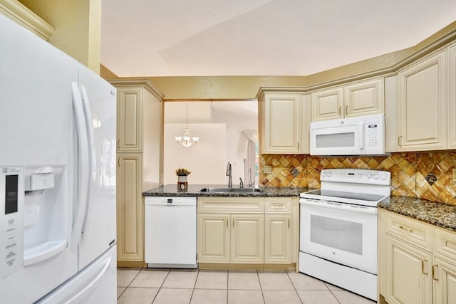 8140 Palm Gate Dr, Boynton Beach, FL 33436 - kitchen featuring white appliances, cream cabinets, and decorative backsplash