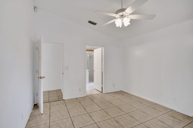 8140 Palm Gate Dr, Boynton Beach, FL 33436 - spare room with vaulted ceiling, light tile patterned flooring, and a ceiling fan