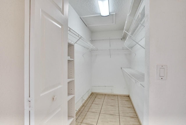 8140 Palm Gate Dr, Boynton Beach, FL 33436 - walk in closet with light tile patterned floors