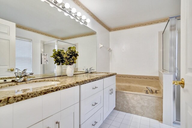 8140 Palm Gate Dr, Boynton Beach, FL 33436 - full bathroom featuring double vanity, a garden tub, a stall shower, and tile patterned floors