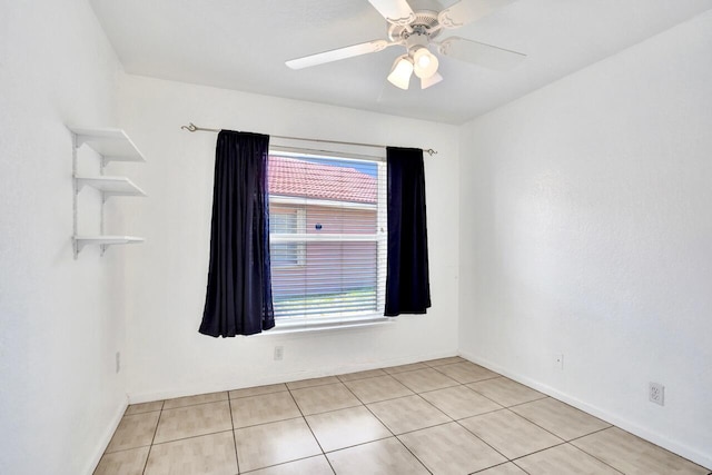 8140 Palm Gate Dr, Boynton Beach, FL 33436 - unfurnished room with healthy amount of natural light, light tile patterned floors, and a ceiling fan