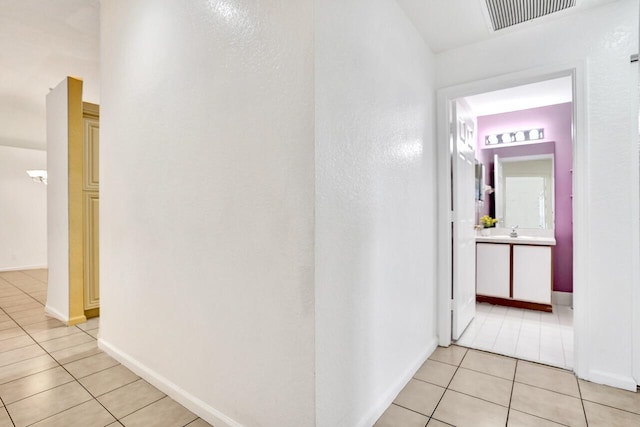 8140 Palm Gate Dr, Boynton Beach, FL 33436 - hall featuring light tile patterned floors and a sink