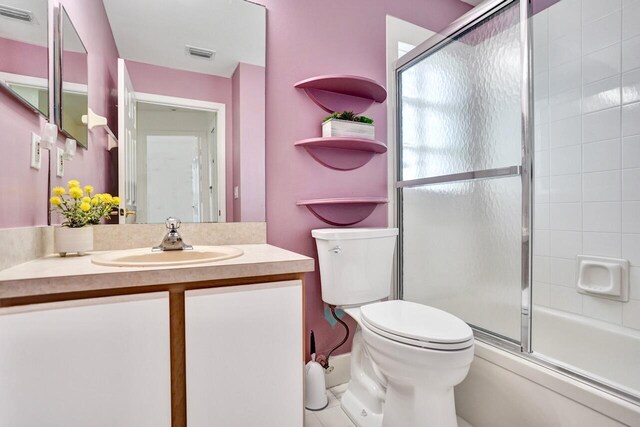 8140 Palm Gate Dr, Boynton Beach, FL 33436 - bathroom featuring vanity and shower / bath combination with glass door