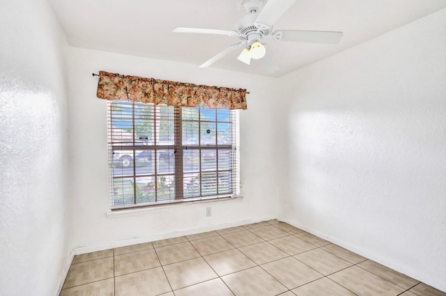 8140 Palm Gate Dr, Boynton Beach, FL 33436 - empty room with light tile patterned floors and ceiling fan