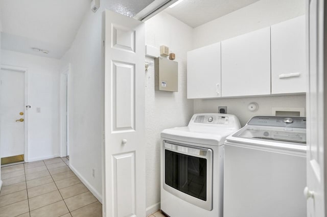 8140 Palm Gate Dr, Boynton Beach, FL 33436 - washroom with cabinet space, washing machine and dryer, and light tile patterned floors