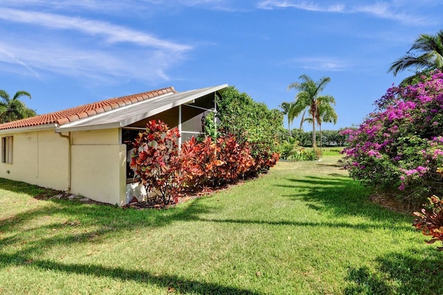 8140 Palm Gate Dr, Boynton Beach, FL 33436 - view of home's exterior featuring a tile roof, a yard, and stucco siding