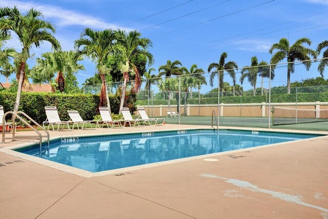 8140 Palm Gate Dr, Boynton Beach, FL 33436 - community pool with a patio area