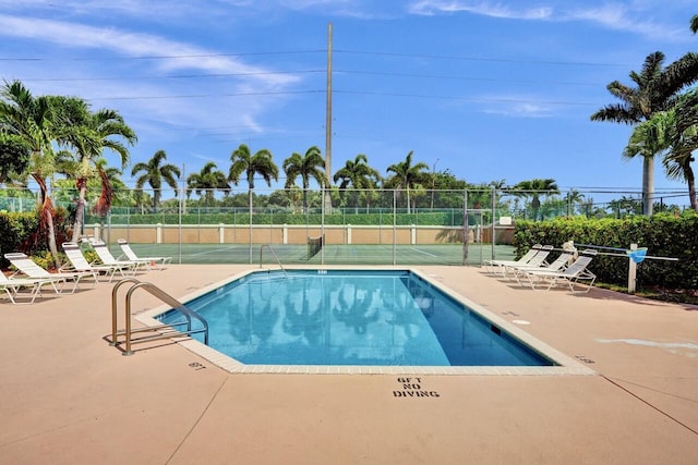 8140 Palm Gate Dr, Boynton Beach, FL 33436 - community pool featuring a patio and a tennis court