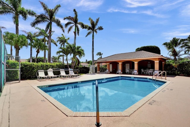 8140 Palm Gate Dr, Boynton Beach, FL 33436 - community pool featuring a patio