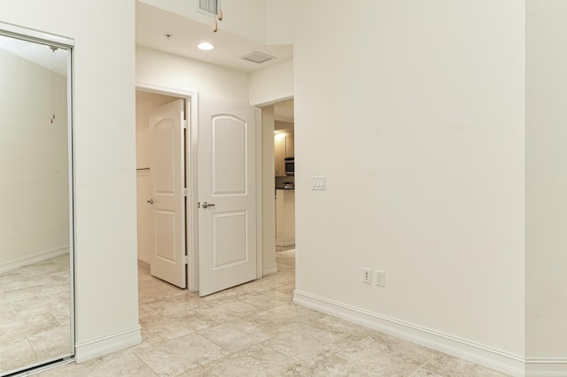 701 S Olive Ave Unit 1208, West Palm Beach, FL 33401 - hallway featuring baseboards