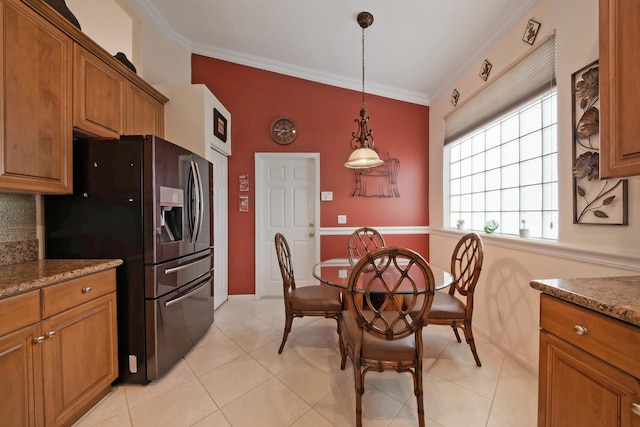 7052 Cataluna Cir, Delray Beach, FL 33446 - kitchen featuring refrigerator with ice dispenser, brown cabinetry, ornamental molding, hanging light fixtures, and light tile patterned flooring
