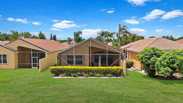 7052 Cataluna Cir, Delray Beach, FL 33446 - rear view of house with stucco siding, a tile roof, and a lawn