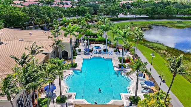 7052 Cataluna Cir, Delray Beach, FL 33446 - community pool with a water view, a patio, and view of wooded area