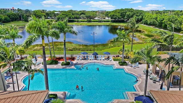 7052 Cataluna Cir, Delray Beach, FL 33446 - community pool featuring a patio, a water view, and view of scattered trees
