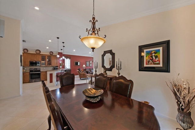 7052 Cataluna Cir, Delray Beach, FL 33446 - dining space with light tile patterned floors, ornamental molding, and recessed lighting