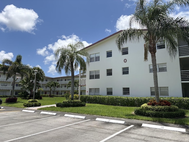 613 Fanshaw O Unit 613O, Boca Raton, FL 33434 - view of building exterior with uncovered parking
